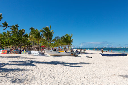 PUNTA CANA, DOMINICAN REPUBLIC - January 27, 2022: Beautiful beach with boats, caribbean travel destinations for tourists, playa Bibijagua, Bavaroのeditorial素材