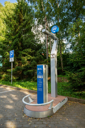YANTARNY, RUSSIA - JUNE 27, 2021: Electric car charging in nature, electrofilling stations (EZS) for electric vehicles, ecology conceptのeditorial素材