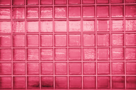 Glass brick wall, abstract background colored in trendy color of the year 2023 - Viva Magentaの写真素材