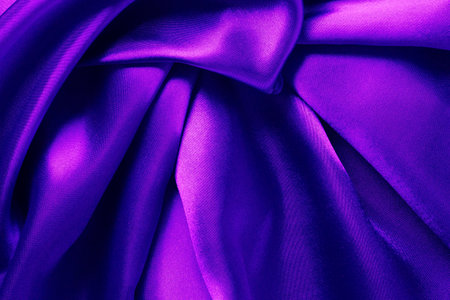 Pink and purple color atlas material background, silky abstract textile surface, drapery clothの写真素材
