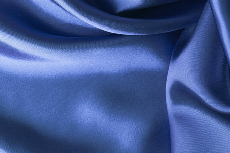 Detail of blue color atlas material background, silk abstract textile surface, drapery clothの写真素材