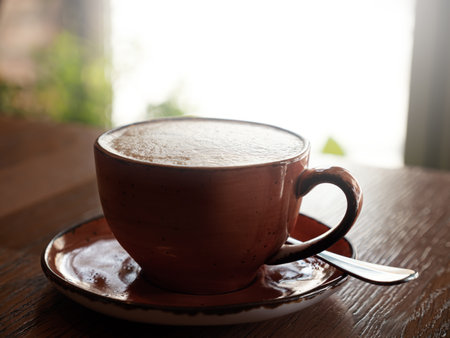 Cup of coffee on table in cafe infront of window. Closeup. Nobodyの写真素材