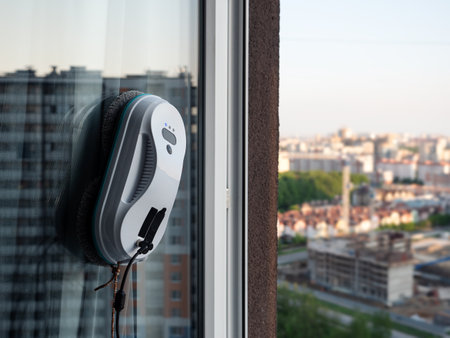 Smart vacuum cleaner washing windows. home appliance and technology conceptの写真素材