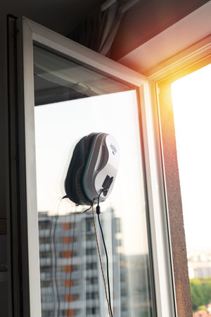 Smart vacuum cleaner washing windows. home appliance and technology conceptの写真素材