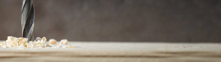 Drill with sawdust. Closeup tools for construction. Long bannerの写真素材