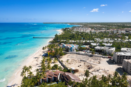 Tropical coastline with resorts, palm trees and Caribbean sea. Travel destinations. Dominican Republic. Aerial viewの写真素材