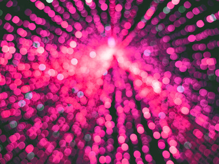 Blurred pink christmas tree with lights. Blur balls bokeh background. New year cardの写真素材