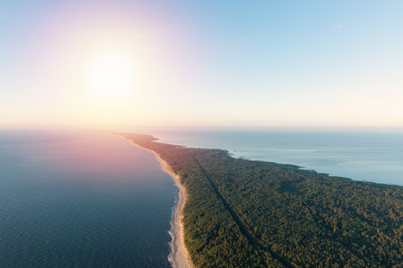 Curonian Spit wth Baltic sea coastline on sunset. Kurshskaya kosa national park near Zelenogradsk. Kaliningrad region. Aerial viewの写真素材