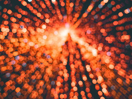 Blurred red christmas tree with lights. Blur balls bokeh background. New year cardの写真素材