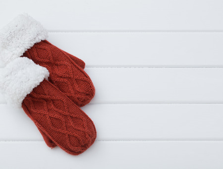 red mittens on wooden backgroundの写真素材