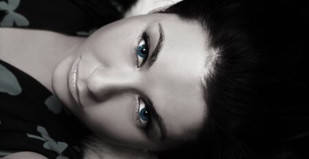 beautiful brunette lying in studioの写真素材