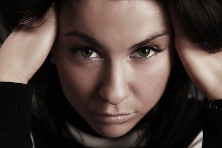 adorable thoughtful brunette with green eyesの写真素材