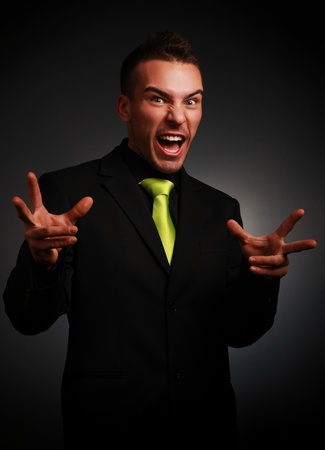 young businessman making  funny faceの写真素材