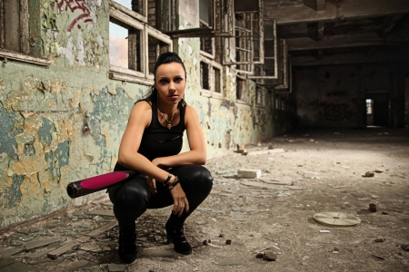 beautiful brunette with baseball batの写真素材