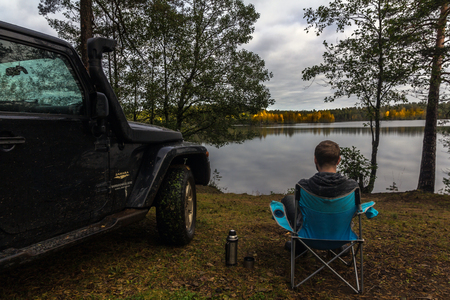 Karelian Isthmus, Leningrad, Russia, September 25, 2016 Jeep Wrangler on the lake, the Jeep Wrangler is a compact four wheel drive off road and sport utility vehicleのeditorial素材