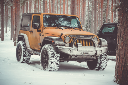 Karelian isthmus, Leningrad region, Russia - January 15, 2017. Jeep Wrangler unlimited on a forest...