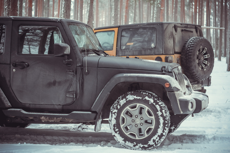 Karelian isthmus, Leningrad region, Russia - January 15, 2017. Jeep Wrangler unlimited on a forest road, the Wrangler is a compact SUV produced by Chryslerのeditorial素材