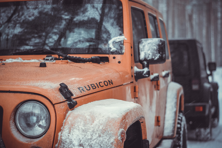 Karelian isthmus, Leningrad region, Russia - January 15, 2017. Jeep Wrangler unlimited on a forest road, the Wrangler is a compact SUV produced by Chryslerのeditorial素材
