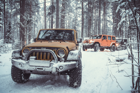 Karelian isthmus, Leningrad region, Russia - January 15, 2017. Jeep Wrangler unlimited on a forest road, the Wrangler is a compact SUV produced by Chryslerのeditorial素材