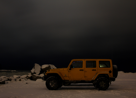 Karelian isthmus, Leningrad region, Russia - January 15, 2017. Jeep Wrangler unlimited on a forest road, the Wrangler is a compact SUV produced by Chryslerのeditorial素材