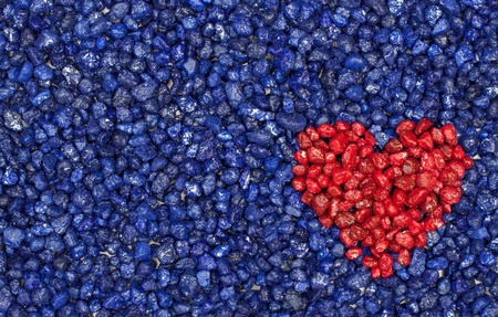blue background with red heartの写真素材