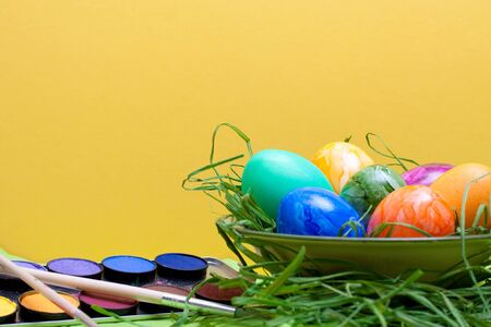 yellow easter background with watercolor box and eggs