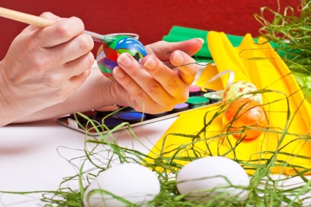 closeup table full of colorful Easter eggsの写真素材