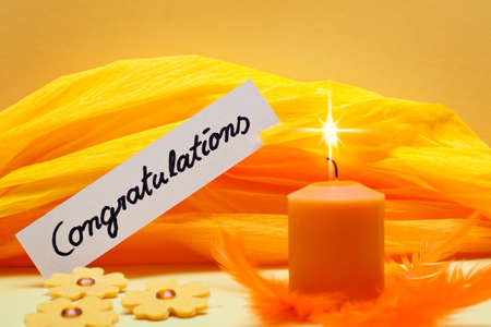 orange background with shield congratulationsの写真素材