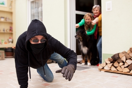 Burglars trys to flee from the crime sceneの写真素材