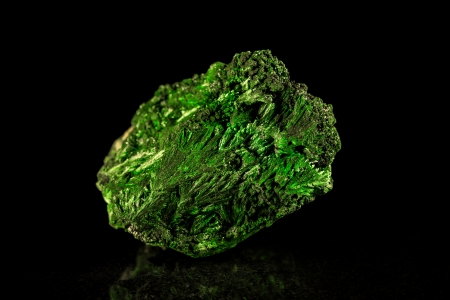 Malachite mineral stone in front of blackの写真素材
