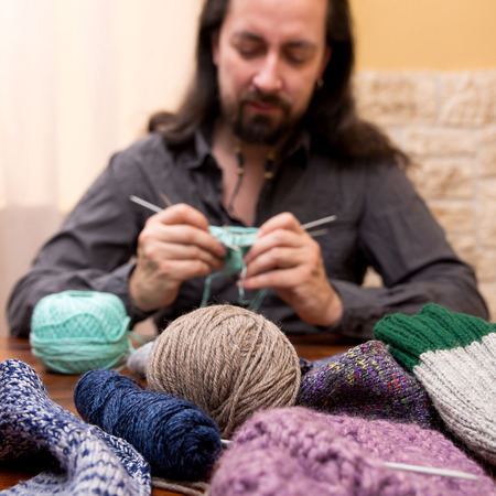 knitting man with a lot of woolの写真素材