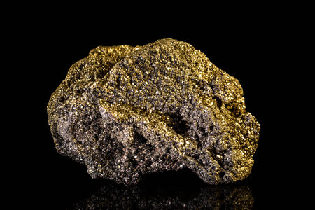Yellow Pyrite mineral Stone in front of Black