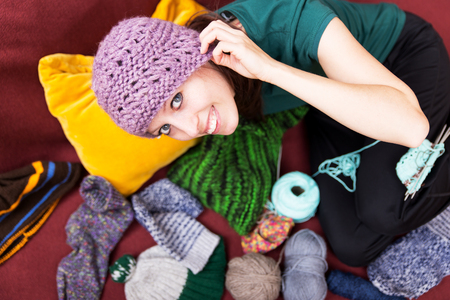 pretty young woman with a wool hatの写真素材