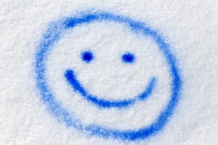 blue funny smiley sprayed in the snow