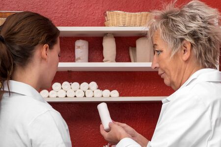 female doctor and student, doctor is explaining somethingの写真素材