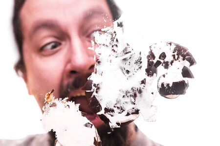 man with smashed chocolate marshmallow on a pane