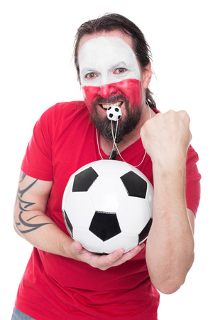 male polish soccer fan with ball in hands looks happy, isolated on whiteの写真素材
