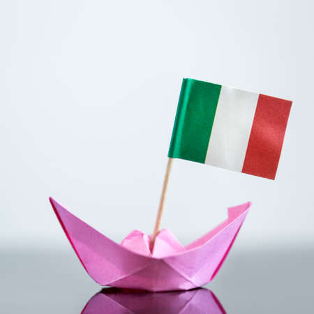 paper ship with italian and european flag, concept shipment or free trade agreement and membership of euの写真素材