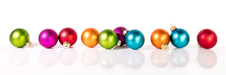 banner with christmas balls in front of a white backgroundの写真素材