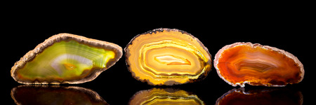 three agate slice, black background, healing stone and mineral, Panorama, bannerの写真素材