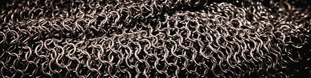 Header from a od chainmail, middle ages knight armor, background