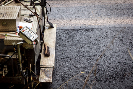 asphalt finisher, big paver constructing a asphalt roadの写真素材