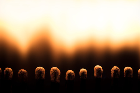 closeup, matchsticks are burning, fire and flames with copyspaceの写真素材