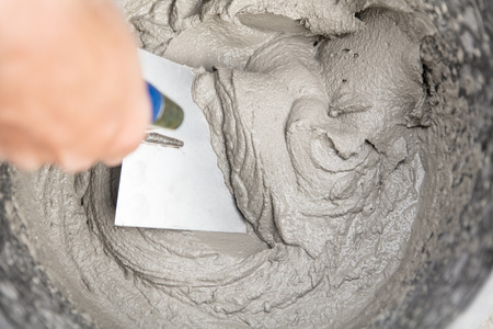 fresh cement or mortar mixed with water, topview and closeup