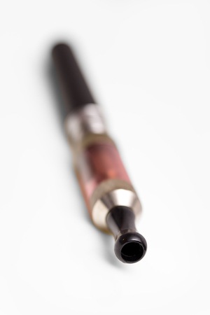electric cigarette on a white background with reflections, verticalの写真素材