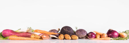 panorama with various vegetables in front of white backgroundの写真素材