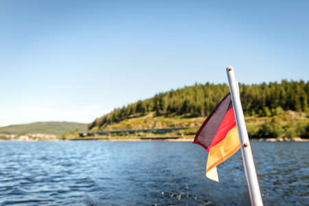 Landscape of the Schluchsee lake and a german flag, copyspaceの写真素材