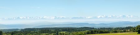 The Alps faraway, german Black forest in the front, Panorama with copyspaceの写真素材