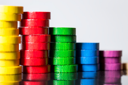 Colorful wooden stacks with reflections, concept finance and business