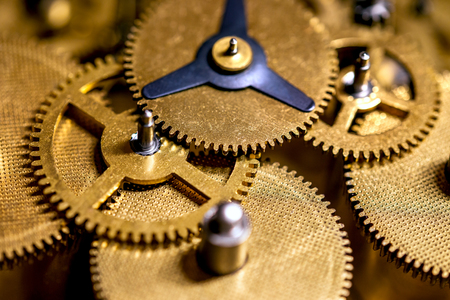 Macro details of gearwheels from a clockwork, precision and accuracy